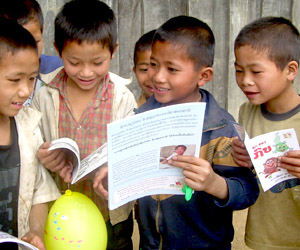 Children in rural Laos, with their first book